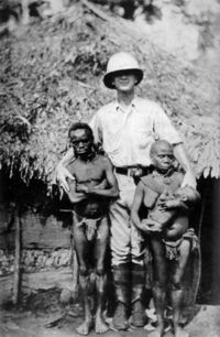 Pygmies and a European explorer. Some pygmies would be exposed in human zoos, such as Ota Benga displayed by eugenicist Madison Grant in the Bronx Zoo. 