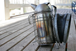 A well used bee smoker