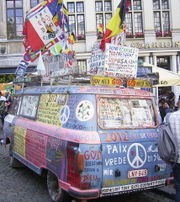 A "flower-power" bus covered with hippie slogans