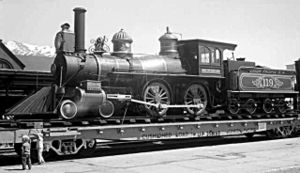 Ex-Virginia and Truckee Railroad #119, a type 4-4-0 steam locomotive, rides atop a Union Pacific Railroad flatcar as it stops in Ogden, Utah on May 9, 1969 just prior to the 100th anniversary of the completion of the First Transcontinental Railroad.