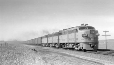 An eastbound Union Pacific freight train, pulled by a trio of ALCO model FA locomotives, passes near Cheyenne, Wyoming in September of 1955.