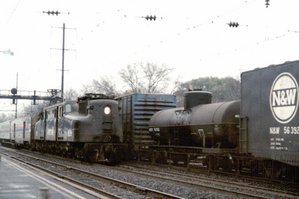 Amtrak #928, a former PRR GG1, speeds through North Elizabeth, New Jersey in December, 1975.