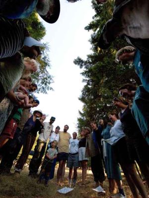 Participants in Diana Leafe Christian's "Heart of a Healthy Community" seminar circle during an afternoon session at O.U.R. Ecovillage