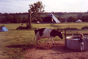 Worthy Farm, a dairy farm for most of the year, is shown here in 1983 as the first festival-goers' tents are pitched.  When the music started the tents stretched half-way to the pyramid stage.