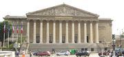 The National Assembly sits in the Palais Bourbon, by the Seine.