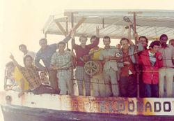 Cuban refugees arriving in crowded boats during the Mariel Boatlift crisis.