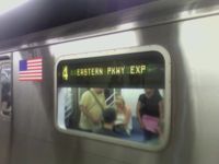 A current sign reading indicating that the train runs express on the Eastern Parkway Line.