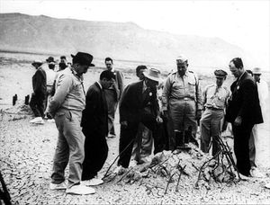 Gen. Leslie R. Groves and others at remains of the Trinity shot tower a few weeks later.