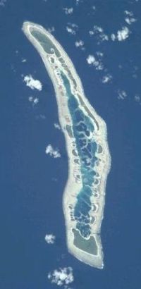 NASA orbital photo of Caroline Island; north is to the upper right. The two largest islets are Nake Islet (top) and South Islet (bottom) and are about 500 m wide.