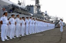 Japanese Sailors beside the Japan Maritime Self-Defense Force (JMSDF) training vessel JDS Kashima, in Pearl Harbor, May 4, 2004.