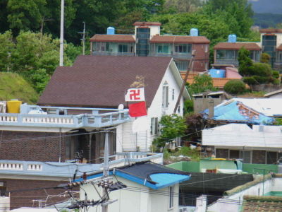 A Buddhist hall in Songtan, South Korea waves its Buddhist flag.