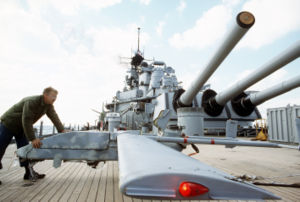 A technician moves a Pioneer RPV across the fantail of Wisconsin.