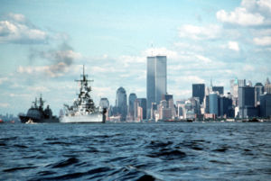 Wisconsin and a guided missile cruiser sit at anchor in the harbor during the New York Fleet Week activities in June 1991.