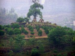 Tombs on a hill facing the Yangtze as it flows by