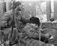 Armenian soldiers firing against Azerbaijani forces from trenches in Nagorno-Karabakh.