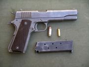 M1911, US Army designation for Colt's .45 semi-automatic.