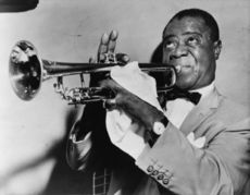 Trumpeter and singer Louis Armstrong, a well-known jazz musician