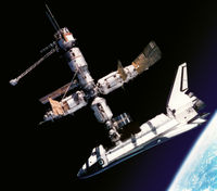 The American Space Shuttle Atlantis docked to the Russian Mir Space Station