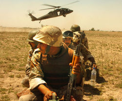 An Iraqi Army unit prepares to board a Task Force Baghdad UH-60 Blackhawk helicopter for a counterinsurgency mission in Baghdad.