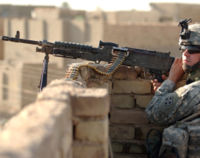 A U.S. soldier with M240 machine gun on patrol in Diwaniyah.