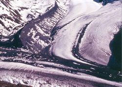 Lateral moraine on a glacier joining the Gorner Glacier, Zermatt, Switzerland. The moraine is the high bank of debris in the top left hand quarter of the picture. For more explanation, click on the picture.