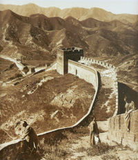 The Great Wall of China in 1907, as photographed by Herbert Ponting. Over the centuries, there had been a number of attempts to build some sort of fortification or earthworks along this route, but the wall that appears here was built during the Ming Dynasty (1368-1644).