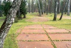 Contours of mass graves, fashioned from limestone tablets; symbolic gravestones