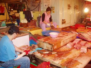 Two local butchers in an alley