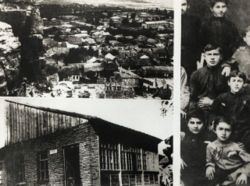 Class photo, Stalin is standing in the back, two boys beyond and his home town of Gori