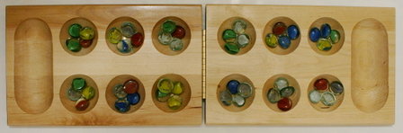 A foldable, wooden Mancala board