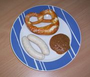 Weißwürste with sweet mustard and pretzel