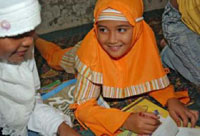 A girl drawing pictures at the rented SOS house in Banda Aceh